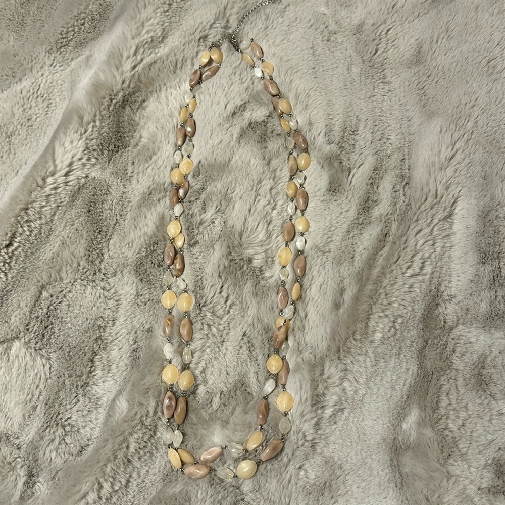 Like new Necklace with neutral colored stones.